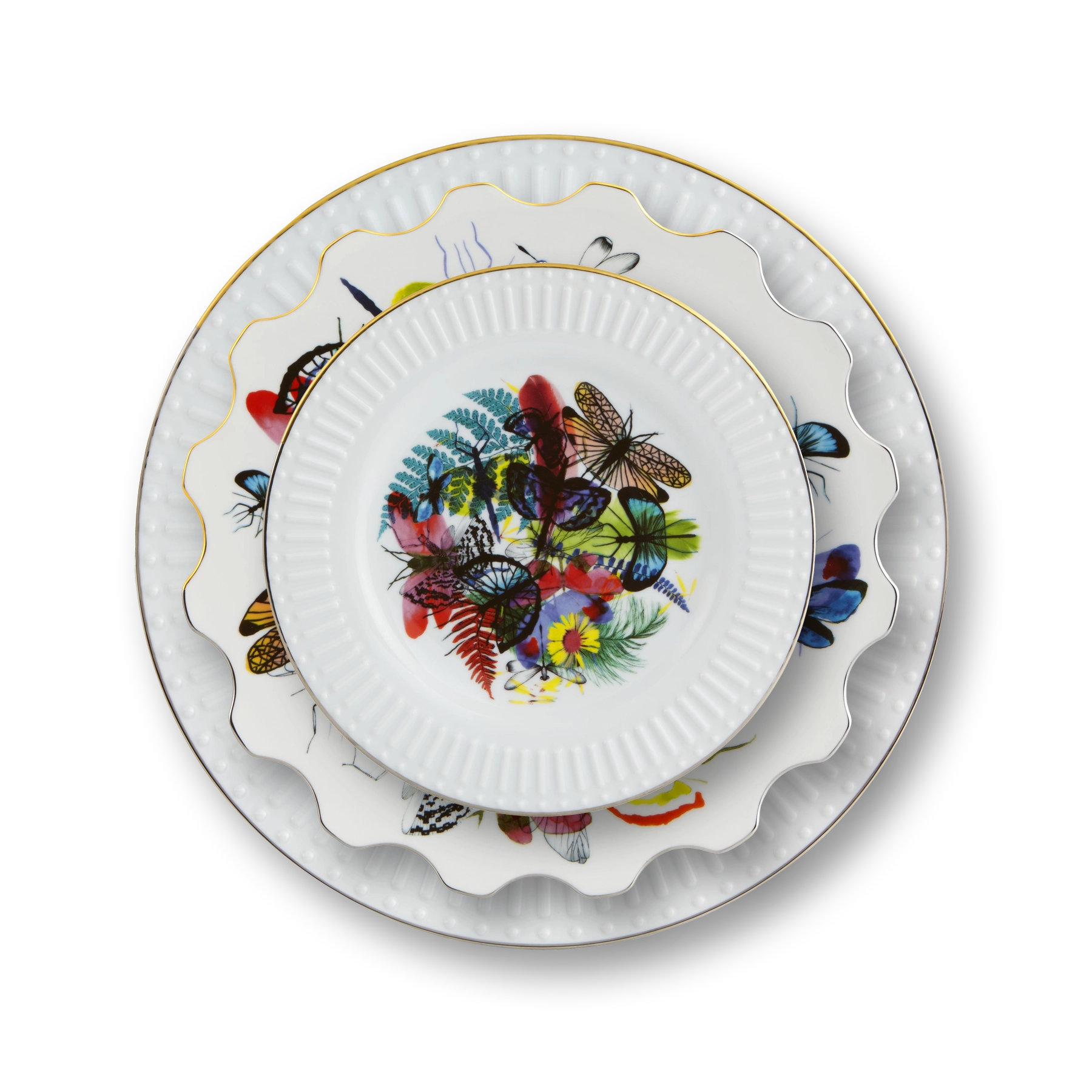 Platos de puesto de la Colección Caribe de Vista Alegre x Christian Lacroix, con motivos de fauna y flora tropical.