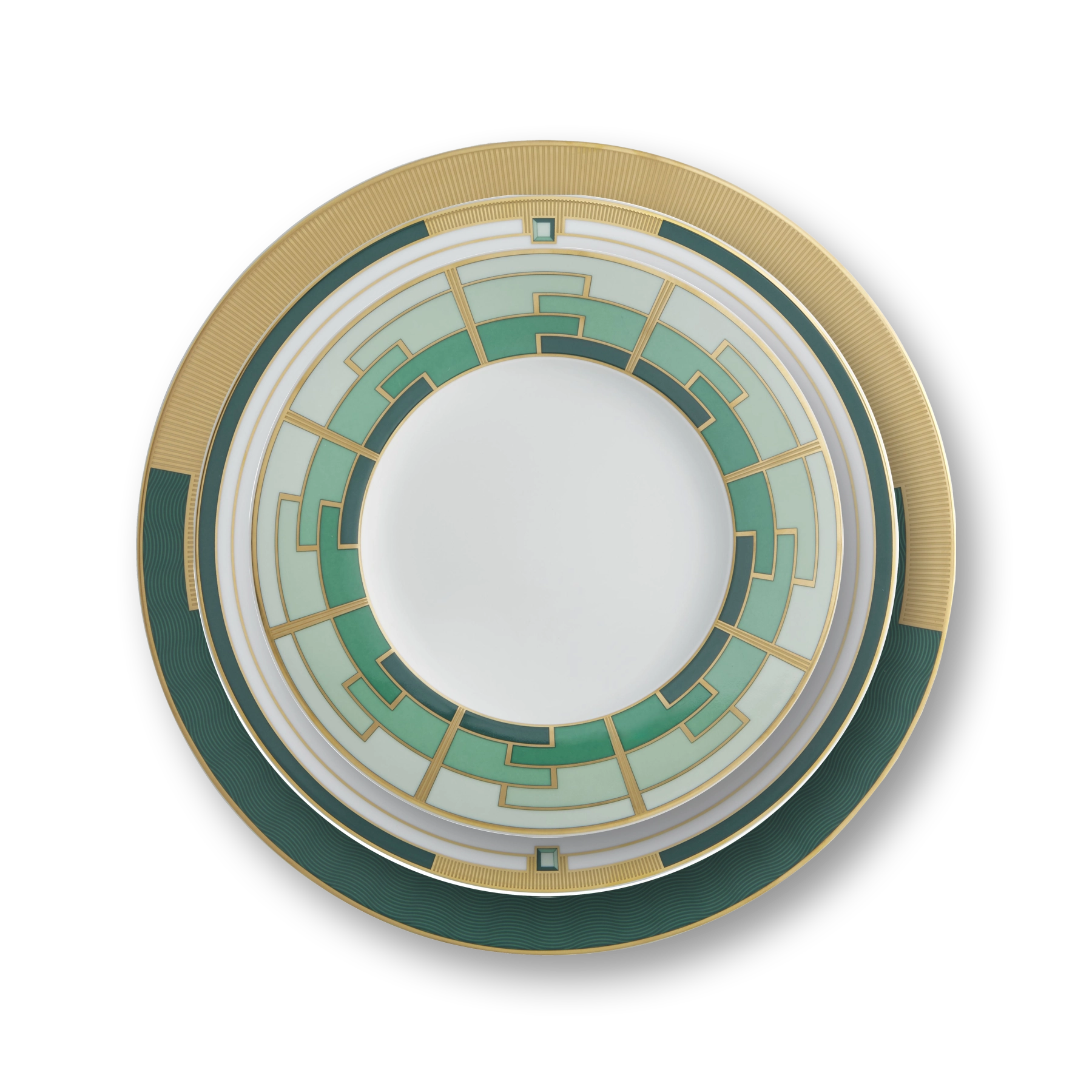 Platos de puesto de la Colección Emerald de Vista Alegre, mostrando el patrón geométrico en verde y oro mate.
