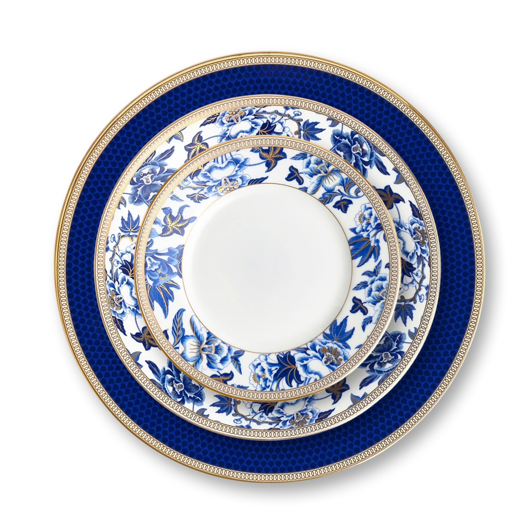 Platos de porcelana de la colección Hibiscus de Wedgwood, con una flor de hibisco y un borde azul y dorado.