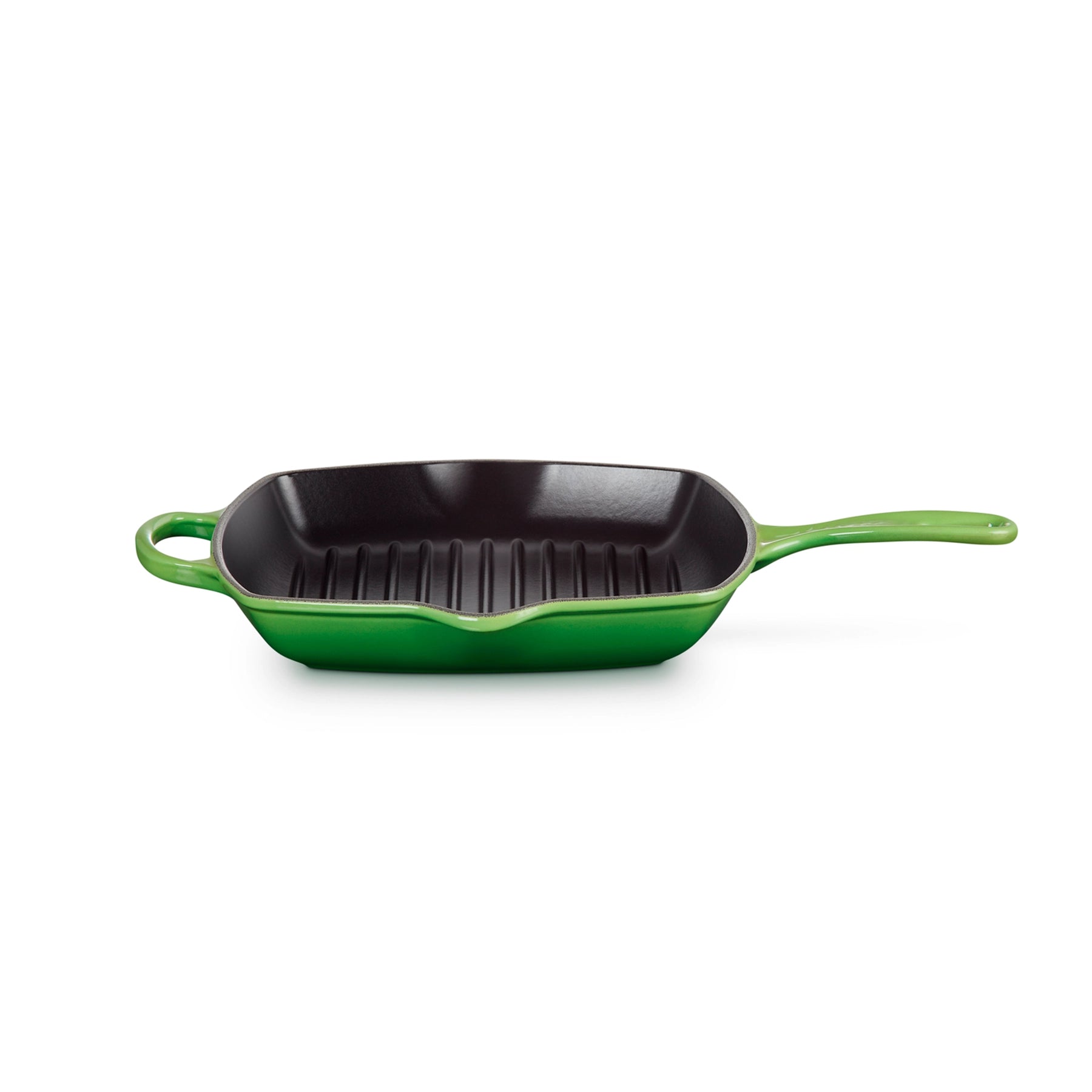 Skillet Grill Cuadrada de Le Creuset, mostrando su superficie interior estriada de hierro fundido para asar alimentos.