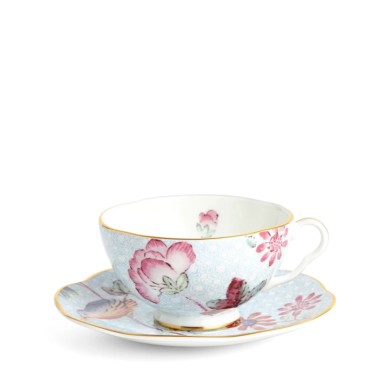 Plato y taza de té azul Cuckoo de porcelana fina con detalles en oro.