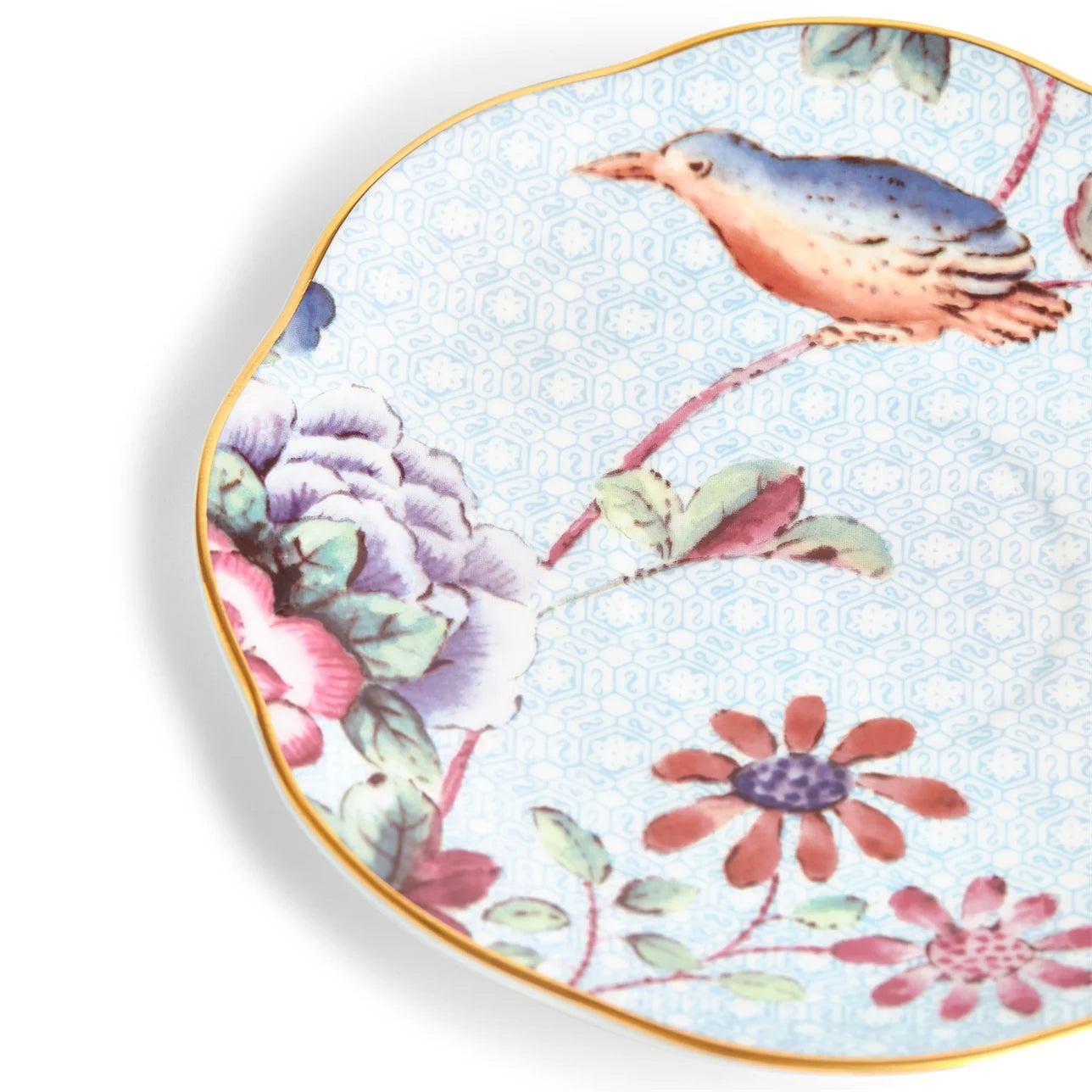Juego de té azul Cuckoo con patrón floral vibrante y contemporáneo.