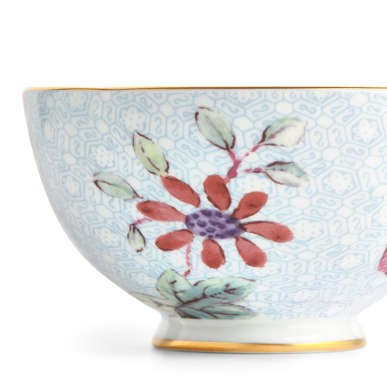 Juego de té azul Cuckoo con patrón floral vibrante y contemporáneo.