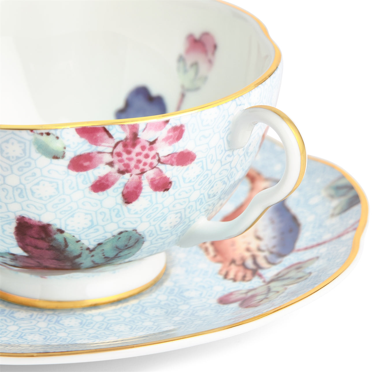 Juego de té azul Cuckoo con patrón floral vibrante y contemporáneo.