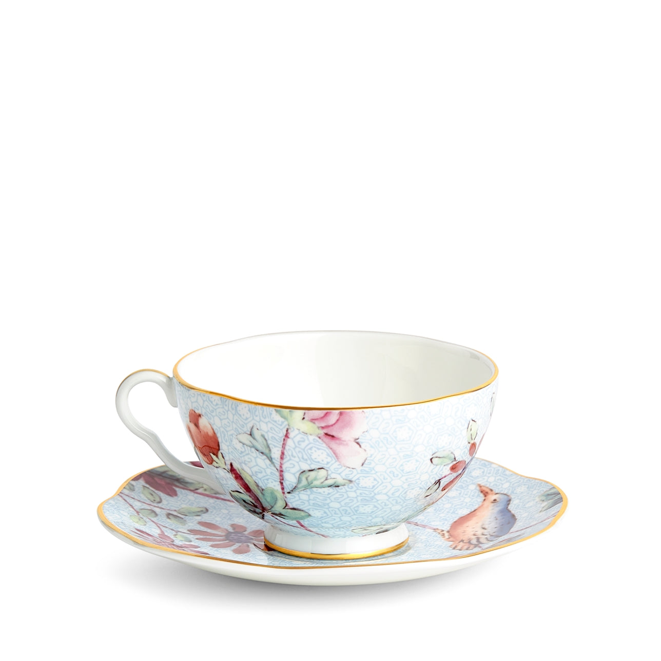 Plato y taza de té azul Cuckoo de porcelana fina con detalles en oro.