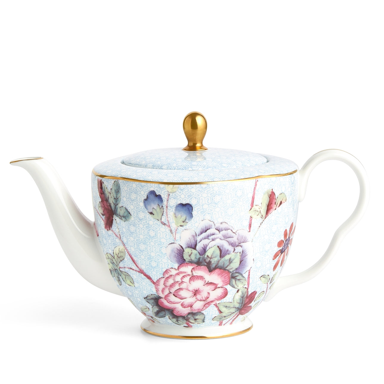 Tetera Grande Cuckoo de porcelana fina con detalles dorados y motivos florales.