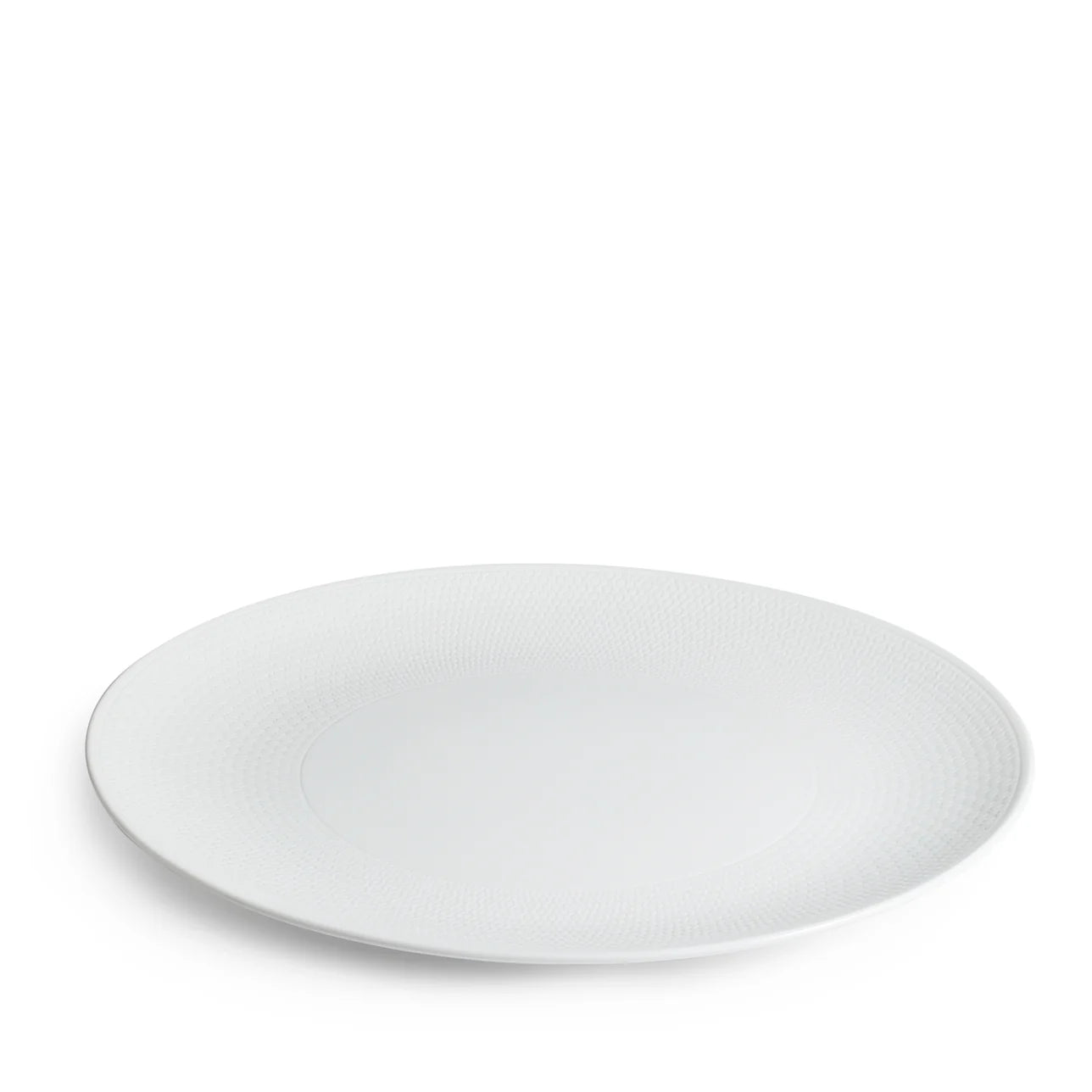 Plato de presentación Gio 31cm de porcelana con textura sutil.