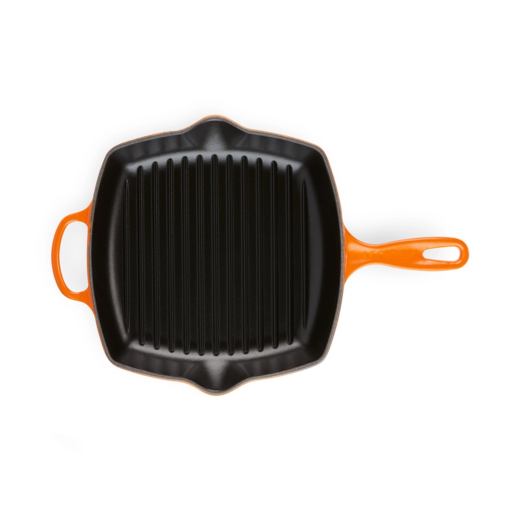 Detalle de los picos vertedores y el asa de la sartén grill Le Creuset, destacando la calidad de su esmalte exterior.