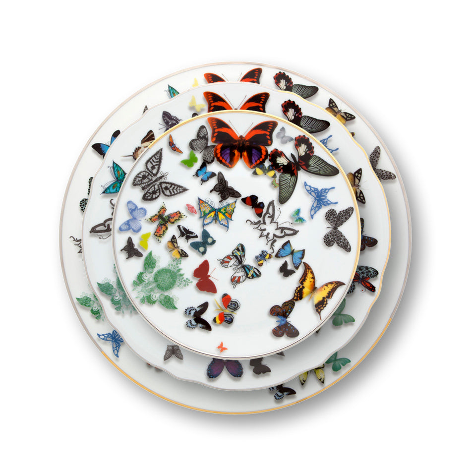 Platos de porcelana Butterfly Parade de Vista Alegre, mostrando el efecto tridimensional de las mariposas y el borde de oro/platino.