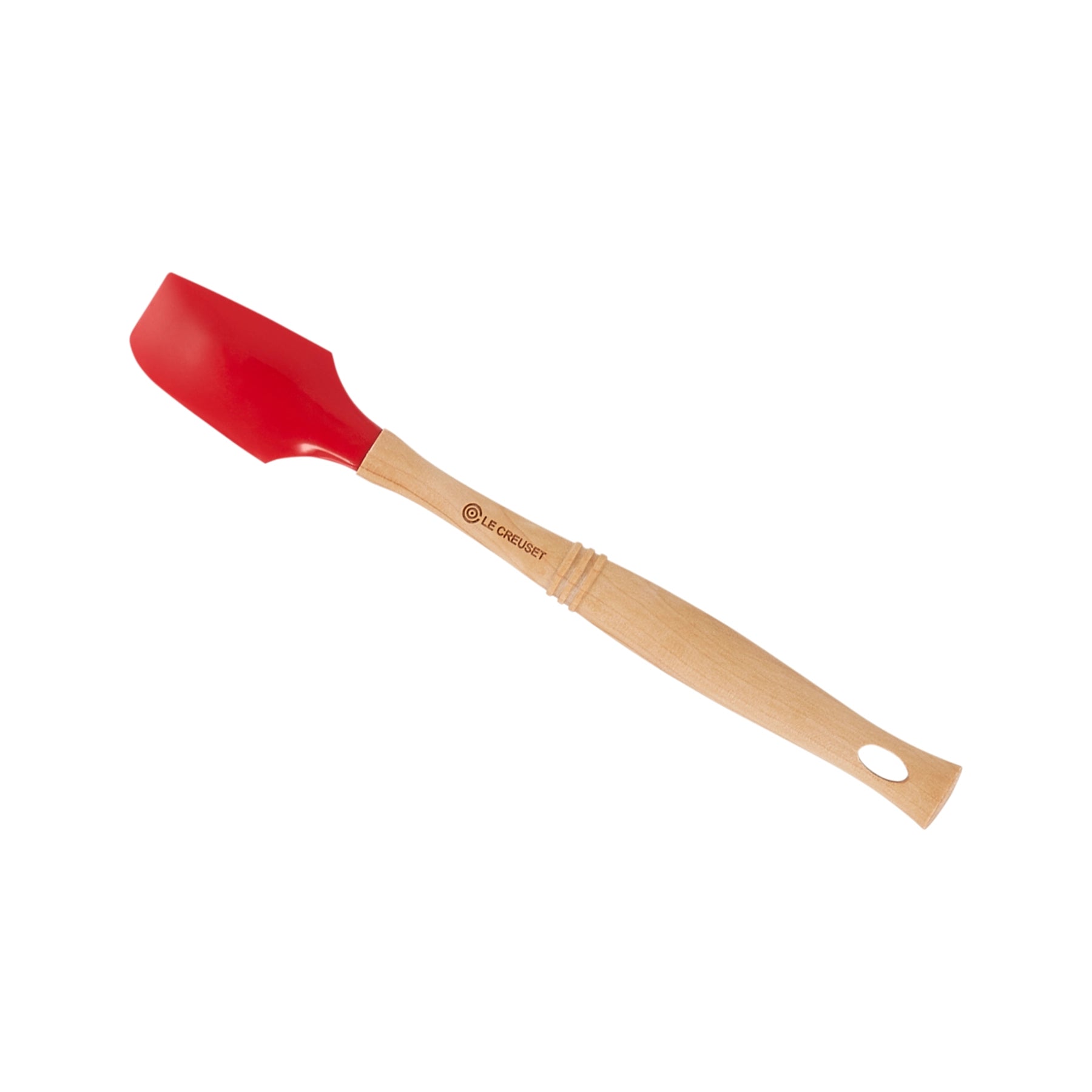 Espátula Pro Cereza de Le Creuset, mostrando su cabezal de silicona roja brillante y su clásico mango de madera.
