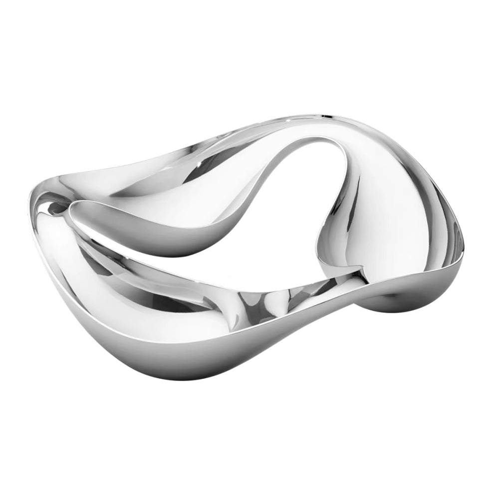 Primer plano del bowl Cobra, resaltando el brillo del acero inoxidable pulido a espejo y la forma fluida.