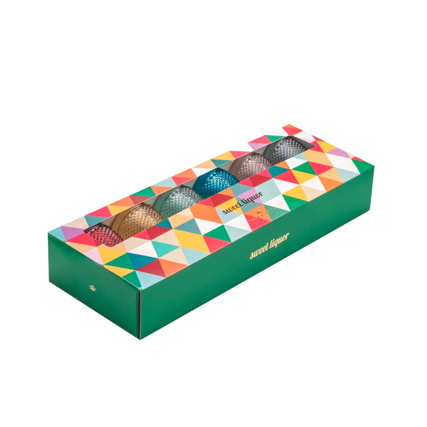 El Set de Copas Bicos servido con licores de colores, ilustrando la inspiración en los macarons y su presentación elegante.